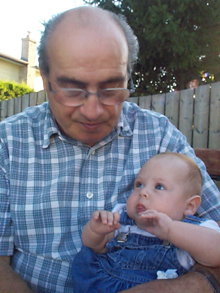 Uncle Salve holding me in his back yard