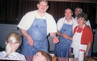 Fr Greg serves pasta